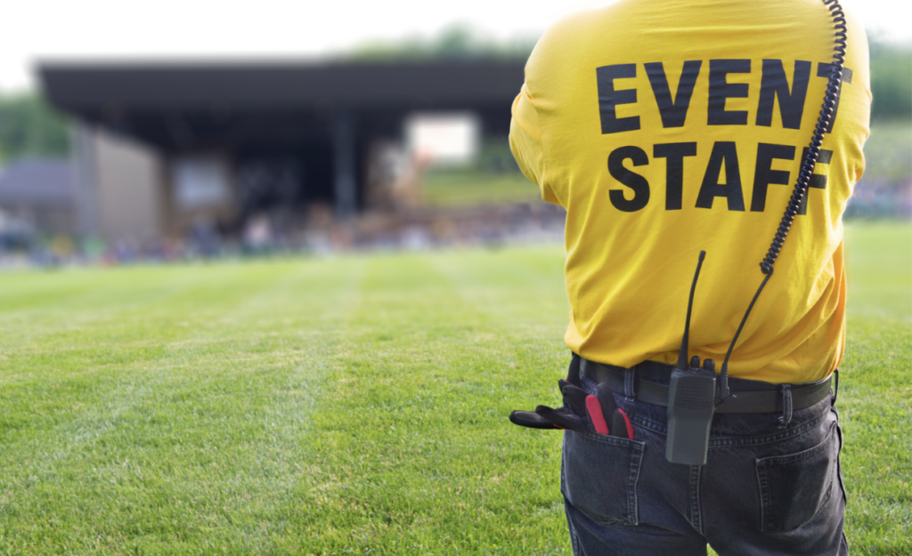 member with event staff shirt and radio