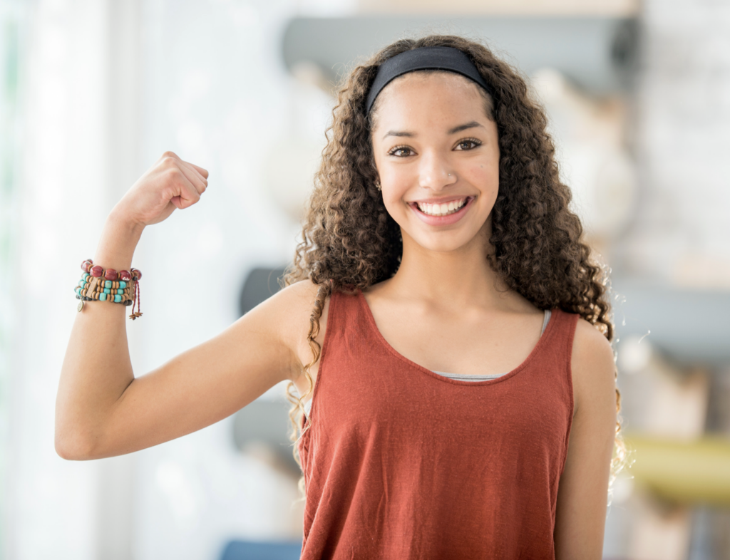 Picture of a teacher making a muscle showing that safety starts with people