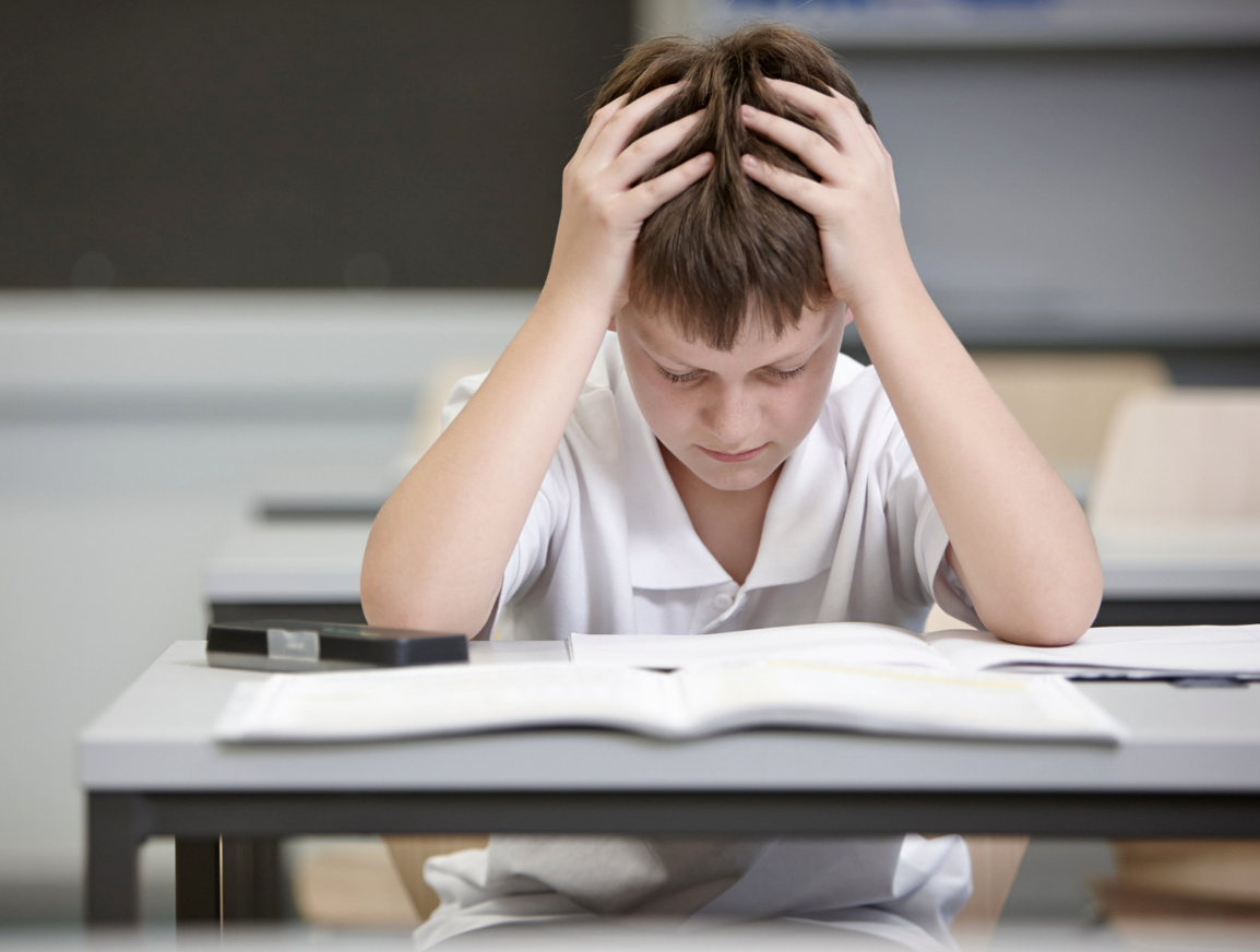 boy struggling in classroom showing that small changes matter